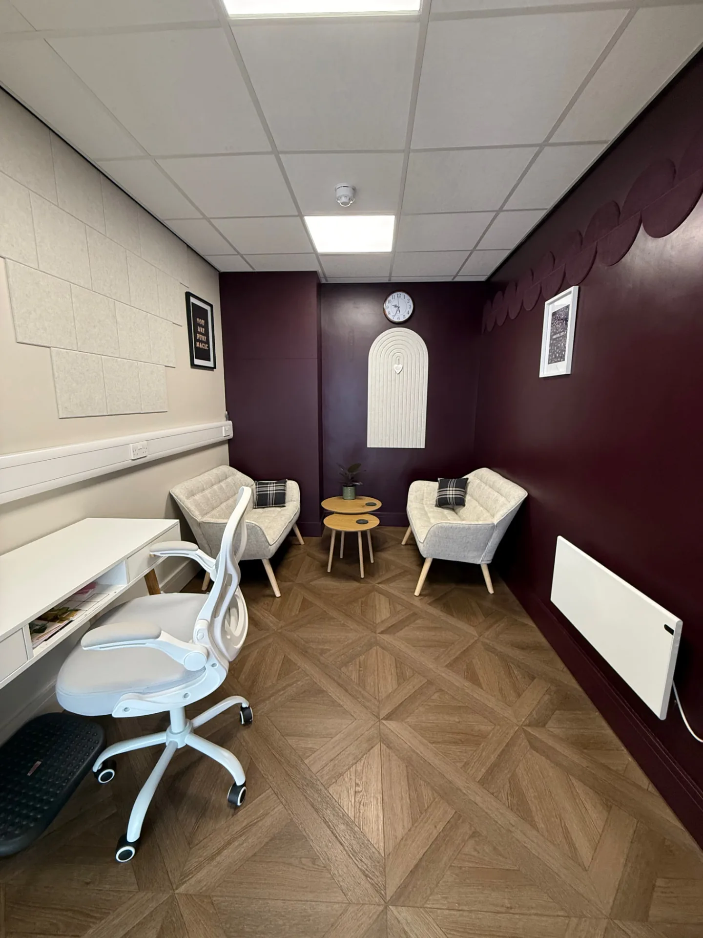 The Rowan Room at The Wellness Lounge Leeds, a talking therapy space with two soft armchairs